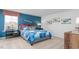 Bedroom with large window, grey bed with blue quilt, decorative pillows, and airplane decor at 487 Lochalsh Dr, Gibsonville, NC 27249