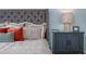 Close up of a fully furnished bedroom featuring an oversized bed, nightstand and decorative pillows at 487 Lochalsh Dr, Gibsonville, NC 27249