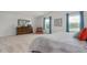 Comfortable bedroom features a large bed, dresser, and windows with ample natural light and cozy decor at 487 Lochalsh Dr, Gibsonville, NC 27249