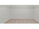 Spacious walk-in closet with ample shelving, providing abundant storage for clothing and accessories at 487 Lochalsh Dr, Gibsonville, NC 27249
