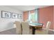 Comfortable dining room area with wood table, carpet, and sheer curtains providing natural light at 487 Lochalsh Dr, Gibsonville, NC 27249