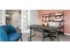 Comfortable work area featuring a neutral desk, a view of the entryway, and a pastel accent wall at 487 Lochalsh Dr, Gibsonville, NC 27249