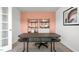 Well-lit home office space featuring neutral colors, modern desk, shelves and view of front yard at 487 Lochalsh Dr, Gibsonville, NC 27249