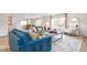 Bright living room featuring hardwood floors, stylish furniture, and large windows with natural light at 487 Lochalsh Dr, Gibsonville, NC 27249