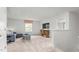 Cozy loft featuring neutral carpet, window with privacy shade, a small sofa and ample entertainment space at 487 Lochalsh Dr, Gibsonville, NC 27249