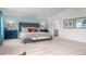 Serene main bedroom with neutral carpet, large bed, and view of the adjoining bathroom at 487 Lochalsh Dr, Gibsonville, NC 27249
