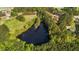 Overhead view of a beautiful lake surrounded by lush greenery and forests, providing a serene and natural backdrop at 50 Gill Ln, Fuquay Varina, NC 27526