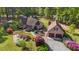 Lovely home with mature landscaping, detached garage and shed, all surrounded by verdant trees at 50 Gill Ln, Fuquay Varina, NC 27526