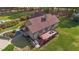 Aerial view showcasing a charming home with a wooden deck, complemented by lush landscaping and mature trees at 50 Gill Ln, Fuquay Varina, NC 27526