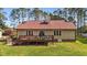 A cozy home featuring a wooden deck perfect for relaxation, with chairs overlooking a lush green lawn at 50 Gill Ln, Fuquay Varina, NC 27526
