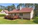 Backyard view featuring a well-maintained lawn and inviting deck, ideal for outdoor enjoyment and entertaining at 50 Gill Ln, Fuquay Varina, NC 27526