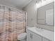 Bathroom features a sleek vanity, large mirror, and neutral-toned shower curtain at 50 Gill Ln, Fuquay Varina, NC 27526