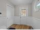 Entryway with hardwood-style floors, beadboard, and lots of natural light at 50 Gill Ln, Fuquay Varina, NC 27526