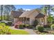 Home exterior featuring manicured landscaping, porch, stone pathway and an elegant architectural design at 50 Gill Ln, Fuquay Varina, NC 27526
