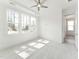 Bright bedroom with hardwood floors, white walls, and a large window offering ample natural light at 512 Gainer Dr # 4, Raleigh, NC 27610
