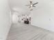 Spacious living room with hardwood floors, white walls, and views into the open kitchen at 512 Gainer Dr # 4, Raleigh, NC 27610