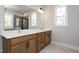 Modern bathroom features a double sink vanity with marble floors and a window with natural light at 528 Folk Song Way, Wendell, NC 27591