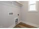 An empty laundry room has tile floors and hookups for a washer and dryer at 528 Folk Song Way, Wendell, NC 27591
