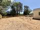 Large, empty backyard with a new wooden fence at 5504 Kingwood Dr, Raleigh, NC 27609