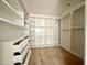 Spacious closet with built-in white shelves and drawers providing ample storage at 5504 Kingwood Dr, Raleigh, NC 27609