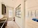 Hallway offering a view into an in-construction kitchen and a light-filled living room at 5504 Kingwood Dr, Raleigh, NC 27609