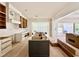 Unfinished kitchen area showcases a modern island, bare cabinets, and open layout to living areas at 5504 Kingwood Dr, Raleigh, NC 27609
