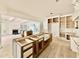 Spacious kitchen features unfinished cabinets, an island, and bright, open access to other living areas at 5504 Kingwood Dr, Raleigh, NC 27609