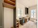 Bright, modern kitchen features gray shaker cabinets, a window, and space for all appliances at 5504 Kingwood Dr, Raleigh, NC 27609