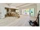 Open concept living room featuring an expansive sliding door and in-construction kitchen at 5504 Kingwood Dr, Raleigh, NC 27609