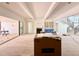 Open concept living room with fireplace, stairs and sliding door to the outside at 5504 Kingwood Dr, Raleigh, NC 27609