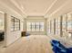 Spacious living room with large windows, tray ceilings and hardwood flooring at 5504 Kingwood Dr, Raleigh, NC 27609