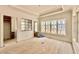 Bright living room featuring a tray ceiling, hardwood floors, and ample natural light at 5504 Kingwood Dr, Raleigh, NC 27609