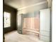 Mudroom featuring gray and wood cabinets and trim details at 5504 Kingwood Dr, Raleigh, NC 27609