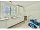 Mudroom with built-in cabinets, countertops, and window at 5504 Kingwood Dr, Raleigh, NC 27609