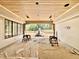 View of the patio under construction with wooden ceiling and siding at 5504 Kingwood Dr, Raleigh, NC 27609