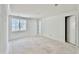 Well-lit, minimalist room features a large window and classic white trim at 5504 Kingwood Dr, Raleigh, NC 27609