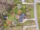Aerial shot of the property, showcasing the home, outbuildings, landscaping, and driveway at 555 Canterwood Dr, Mebane, NC 27302