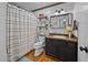 Modern bathroom with wooden floors, shiplap walls, and updated fixtures at 555 Canterwood Dr, Mebane, NC 27302