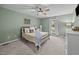Bedroom with green walls, ceiling fan, and natural light from the window at 555 Canterwood Dr, Mebane, NC 27302