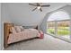 Bedroom features natural light, plush pillows, and unique architectural design at 555 Canterwood Dr, Mebane, NC 27302