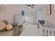 Bedroom features a crib, hardwood floors, and closet space at 555 Canterwood Dr, Mebane, NC 27302
