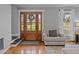 Inviting foyer featuring hardwood floors, a wood door and a comfortable chair at 555 Canterwood Dr, Mebane, NC 27302