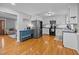 Bright kitchen with stainless appliances, granite countertops, and hardwood floors at 555 Canterwood Dr, Mebane, NC 27302