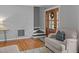 Living room featuring hardwood floors, a cozy chair, and a staircase at 555 Canterwood Dr, Mebane, NC 27302