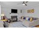 Cozy living room with a fireplace, comfortable seating, and stylish decor at 555 Canterwood Dr, Mebane, NC 27302
