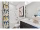 Bathroom featuring a shower-tub combo, modern vanity, and stylish fixtures at 605 Callan View Ave, Wake Forest, NC 27587