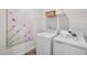 A neatly arranged laundry room, complete with washer, dryer, and storage shelves at 605 Callan View Ave, Wake Forest, NC 27587