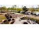 Landscaped community area with a walking path, lake view, and seating at 605 Callan View Ave, Wake Forest, NC 27587