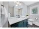 Modern bathroom with double vanity, stylish lighting, gray walls, and tile flooring at 612 E Academy St, Fuquay Varina, NC 27526