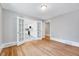 Bedroom featuring beautiful hardwood floors and french doors at 612 E Academy St, Fuquay Varina, NC 27526